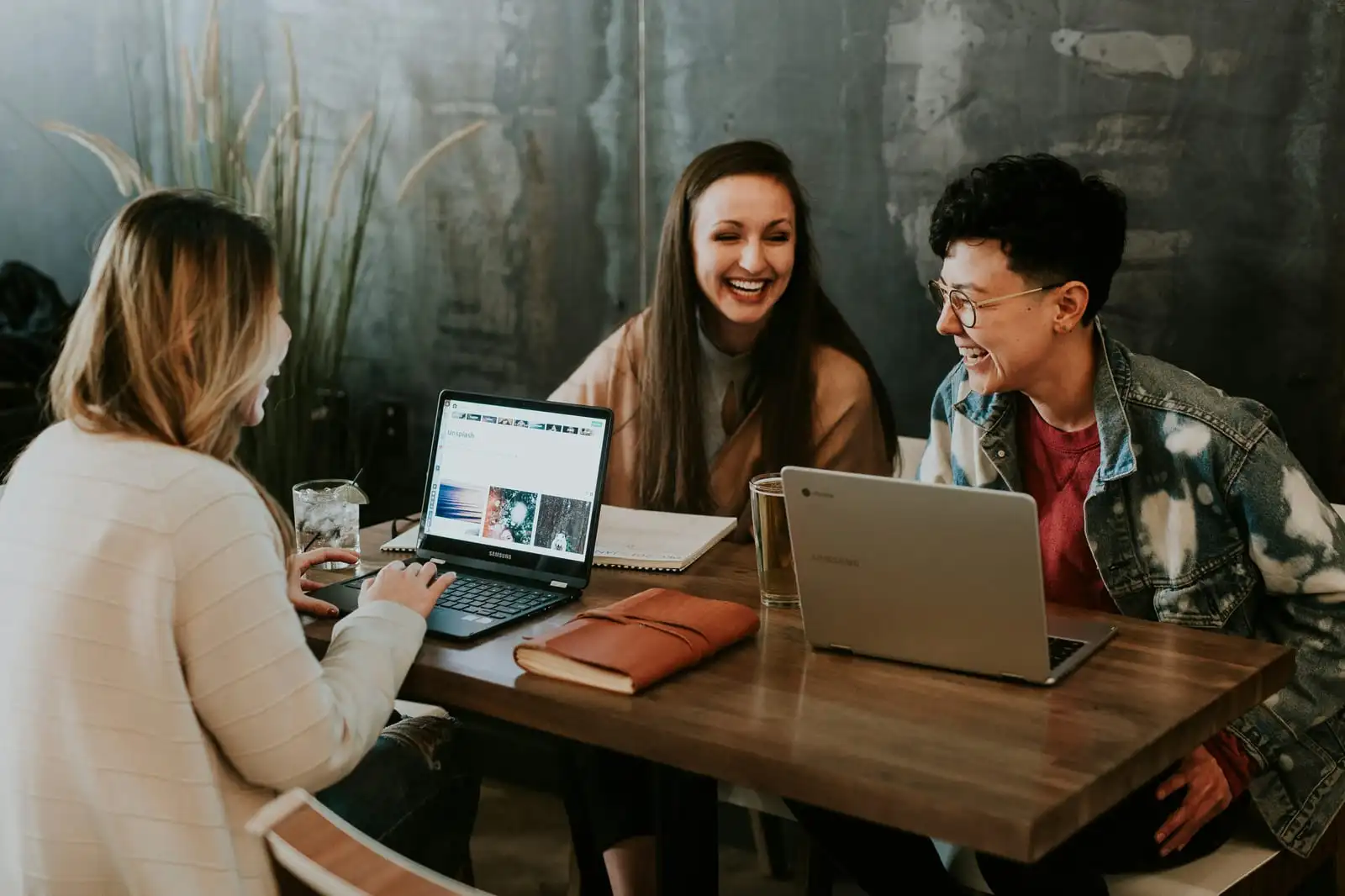Three people learning together around a table