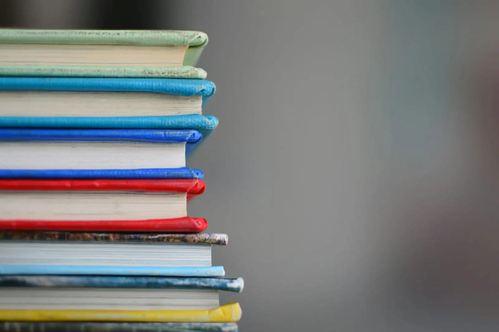 Books arranged on a shelf, softly focused